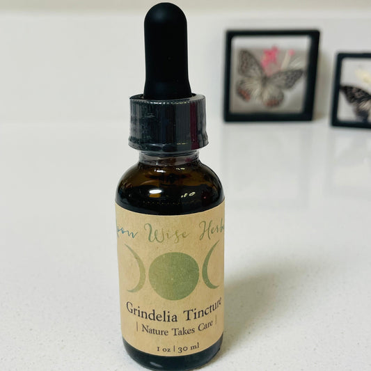 Bottle of Grindelia Tincture with a dropper on a white surface